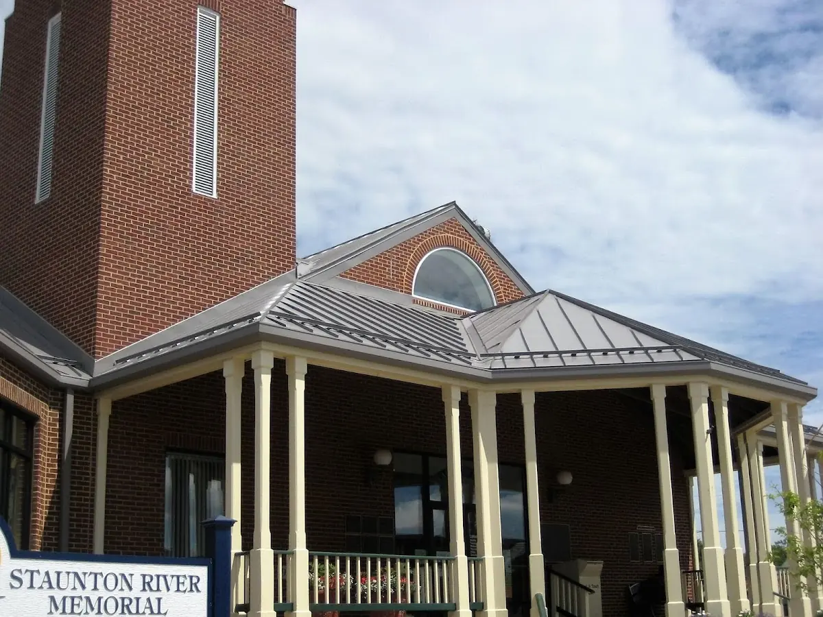 Skilled roofing craftsmen working on a residential roof in Macon-Bibb County